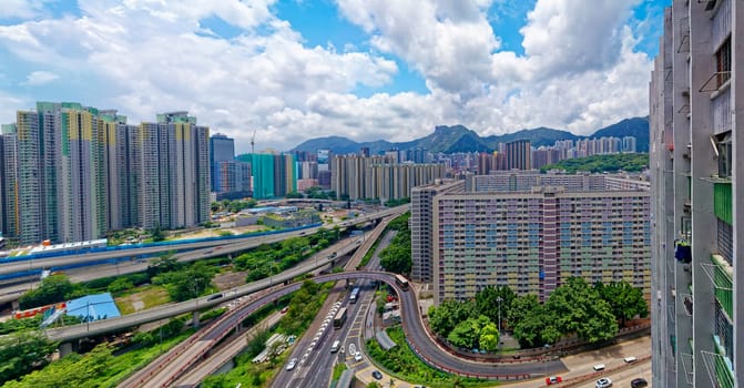 hong kong public estate buildings with landmark lion rock at day