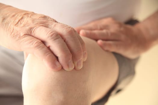 A senior man with a painful knee joint