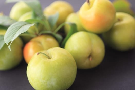 Fresh, ripe summer fruits with leaves