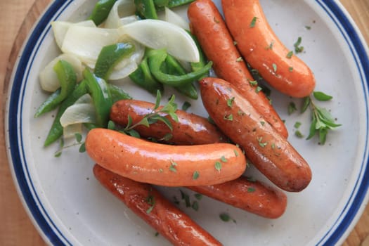 Mixed sausages with peppers, onions and fresh oregano