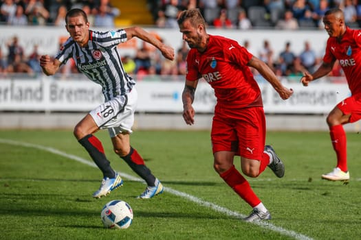 Johannes Flum (Eintracht Frankfurt) and Patrick Dulleck (TSV Steinbach) - TSV Steinbach vs. Eintracht Frankfurt on 30.07.2016 (Photo: Fingerhut)