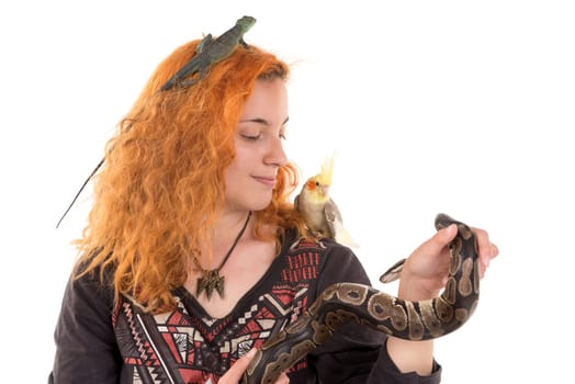 Red hair girl with several pet animals isolated in white