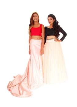 A lovely young women standing isolated for white background in long.pink skirts and red and black top's..