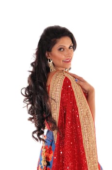 A beautiful woman with long black hair standing from back, looking over.her shoulder with a red scarf, isolated for white background..