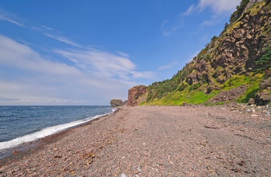 Remote Pebble Beach on a Sunny Day on the Green Gardens Trail in Gros Morne National Park in Newfoundland, Canada