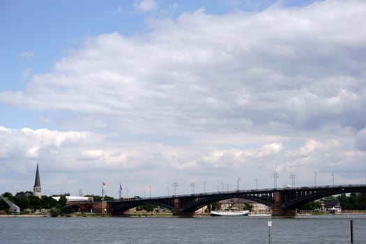 The Theodor Heuss Bridge in Mainz over the River Rhine and the banks in Mainz Kastel with the St. George Church in the background.
