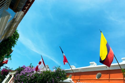 Rows of flags on colonial buildings in Cartagena, Colombia