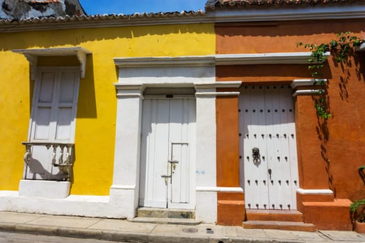 Yellow and orange colonial buildings in the historic center of Cartagena, Colombia