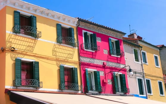 Burano, Venice, Italy - May 10, 2014: Colorful old houses on the Island of Burano near Venice, Italy