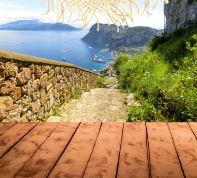 The collage of wooden floor and view of Capri island, Italy. Concept  welcome to paradise