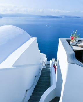 View to the sea from stairs in Oia the most beautiful village of Santorini island in Greece