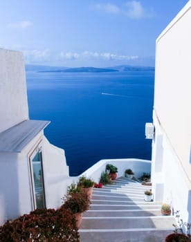 View to the sea from stairs in Oia the most beautiful village of Santorini island in Greece