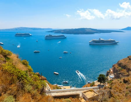 Santorini, Greece - June 10, 2015: The beautiful view of marina bay with cruise ships at the sea
