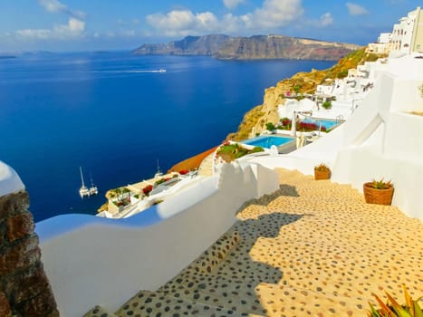 View to the sea from stairs in Oia the most beautiful village of Santorini island in Greece