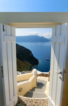 View to the sea from stairs in Oia the most beautiful village of Santorini island in Greece