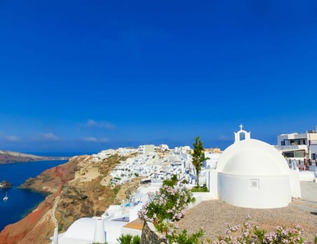 View to the sea from stairs in Oia the most beautiful village of Santorini island in Greece