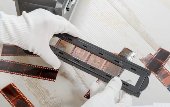 a technician scan a negative film