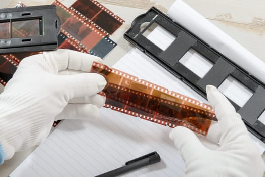 a technician scan a negative film
