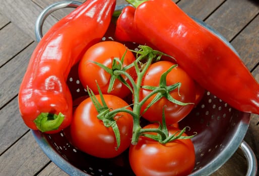 tomatoes and red peppers on table