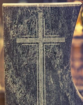 close up on holy cross written in rock