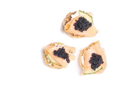 Smoked Salmon Appetizer with Cream Cheese and Caviar isolated on white