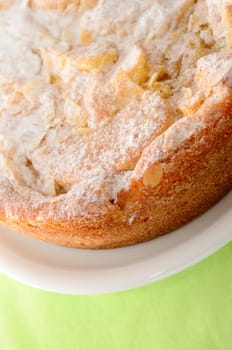 Detail of a sweet cake on a green background