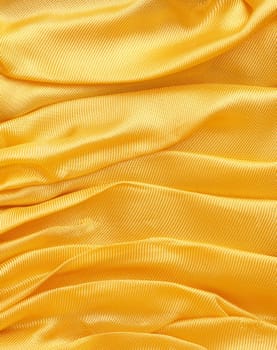 Golden fabric background with space for text or image