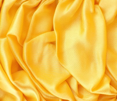 Golden satin fabric texture using as background with space for text or image