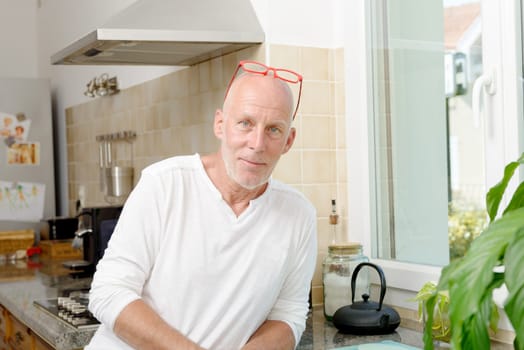 a mature man in the kitchen