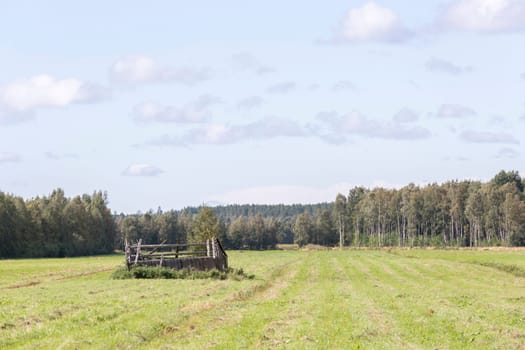 Run Down Barn in Cultivated Field.