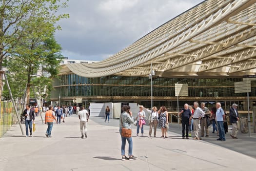 visitors in front of the forum les halles in paris, france