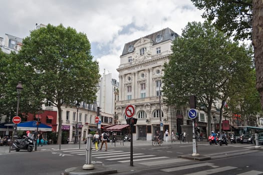 street scene in front of the theater de la Renaissance in Paris