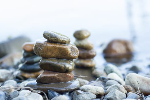 small pyramid of stones on the water