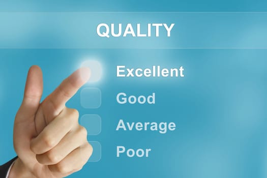 business hand clicking quality button on screen