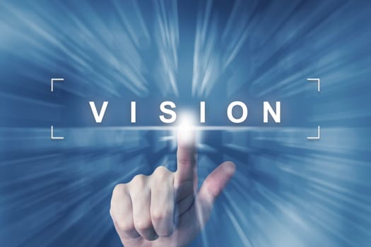 hand clicking on business vision button with zoom effect background