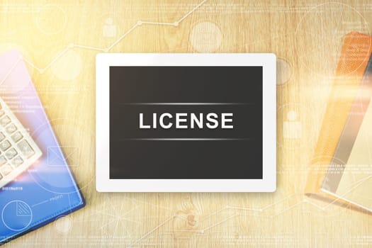 license word on tablet with soft light vintage effect