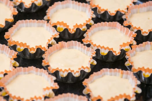 Uncooked cupcakes in tins