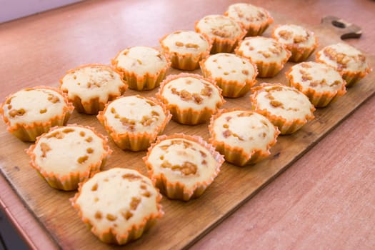Eighteen freshly baked muffins stuffed with boiled condensed milk