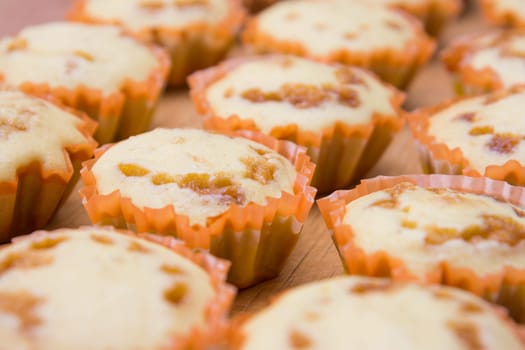 Freshly baked muffins stuffed with caramelized milk closeup