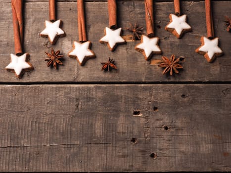Sweet cinnamon stars with anise on a wooden table