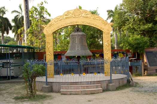Framework supporting huge prayer bell at Saranath near Varanasi, Uttar Pradesh, India, Asia