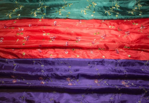 Different color and texture of silk scarf closeup