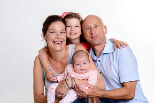 young happy family in front of white background