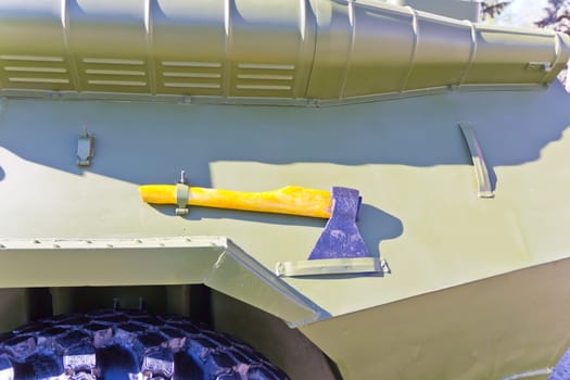 Military machine at the exhibition under open sky with ax