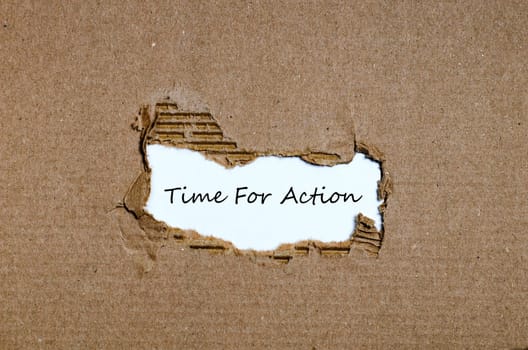 The word time for action appearing behind torn paper