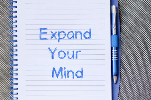 Expand your mind text concept write on notebook