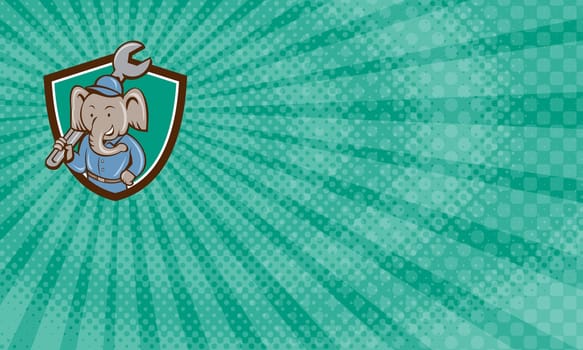 Business card  showing illustration of an elephant mechanic holding spanner on shoulder viewed from front set inside shield crest on isolated background done in cartoon style.