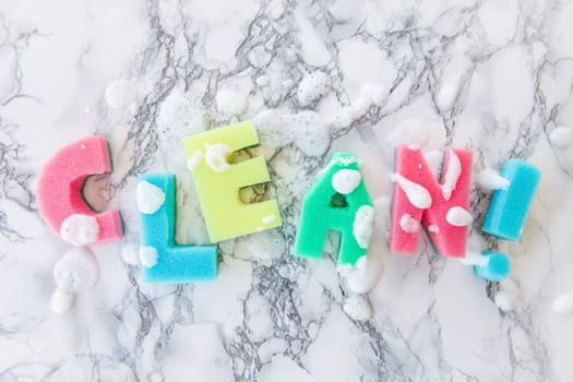 Plaster sponge as lettering Clean on background made of marble