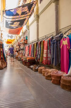 Granada, Spain - August 5, 2016: Narrow streets filled with shops called Alcaiceria, originally home to a Moorish silk market, Granada, Spain