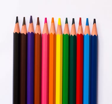 colorful pencils isolated on a white paper background